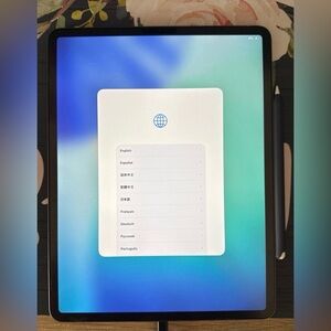 Apple iPad with Black Frame and Dark Gray Apple Pencil